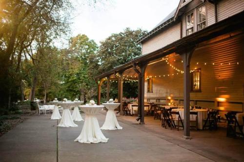 white decorated tables in front of carriage house
